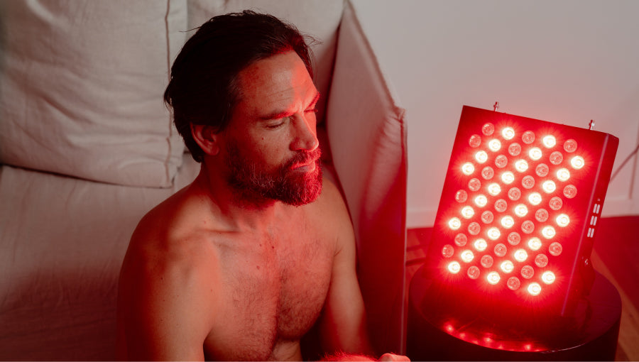 Man using Helsi red light therapy lights for health and wellness